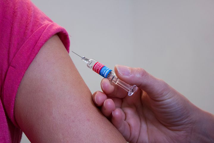 Woman receiving workplace flu vaccinations in Melbourne